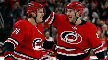 The Hurricanes' Brady Skjei is congratulated on his
