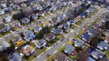An aerial view of rows of houses in