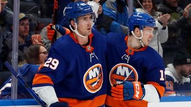 Brock Nelson of the Islanders celebrates his first