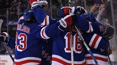 The Rangers celebrate a hat-trick goal by left
