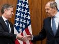 Secretary of State Antony Blinken, left, greets Russian