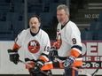 Former linemates Bryan Trottier #19 and Clark Gillies