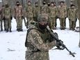 An instructor trains members of Ukraine's Territorial Defense