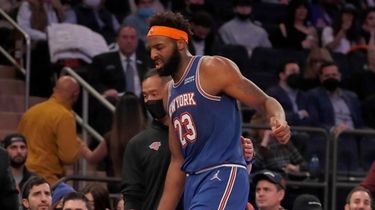 Mitchell Robinson #23 of the Knicks limps off