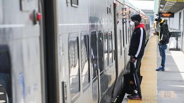 A commuter prepares to board a train at