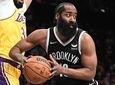 Nets guard James Harden looks to pass the