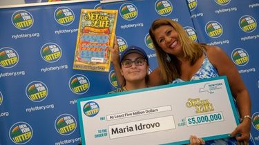 New York Lottery's Yolanda Vega presents a winning