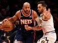Jevon Carter of the= Nets works against Facundo