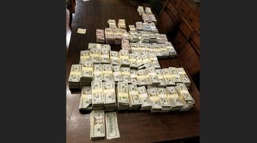 About $900,000 in cash and a ledger documenting