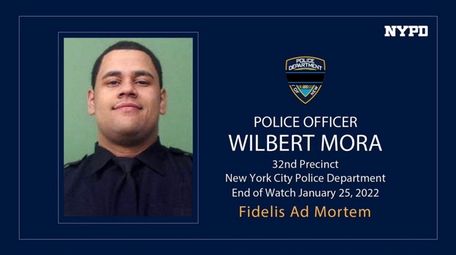 Fallen NYPD Officer Wilbert Mora appears in an
