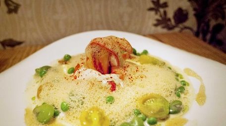 Roots Bistro Gourmand's butter-poached lobster is served with