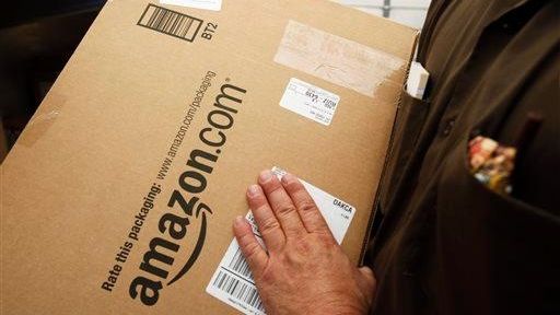 An Amazon.com package is prepared for shipment by