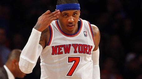 Carmelo Anthony reacts after a basket against the