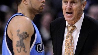 Then-Utah Jazz head coach Jerry Sloan, right, talks