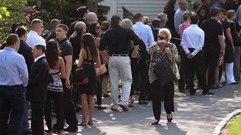 Family and friends attend the wake for Andrea