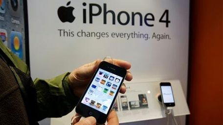 An AT&T customer tries out an Apple iPhone