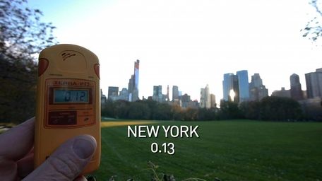 A geiger counter records the radiation level in