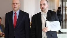 Thomas Moroughan, right, and his attorney, William Petrillo,