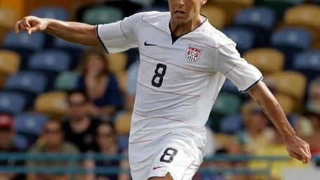 Midfielder Danny Szetela drives with the ball during