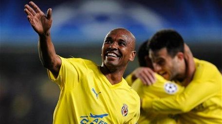 Villarreal's Marcos Senna celebrates after scoring a goal
