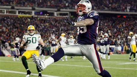 New England Patriots tight end Aaron Hernandez high