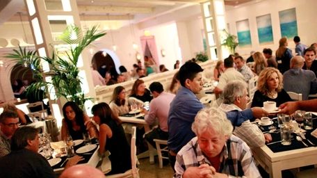 Patrons dine at Kyma in Roslyn. (July 12,