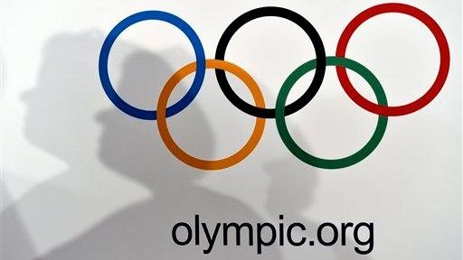 The Olympic rings are seen against a white