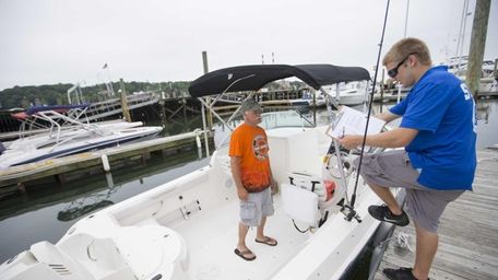Scott McMaster from Holbrook, boards a Striper for