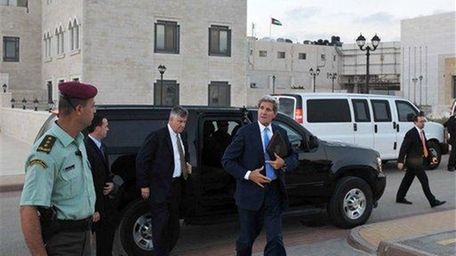 U.S. Secretary of State John Kerry steps out