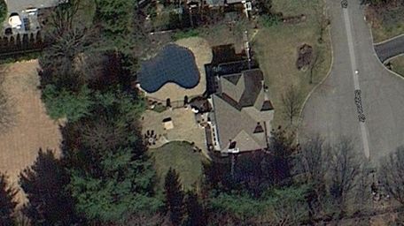 A satellite image of the home at 4