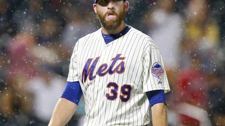 Bobby Parnell of the Mets walks off the