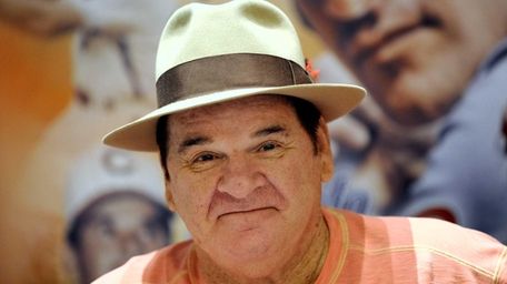 Pete Rose smiles as he waits for his