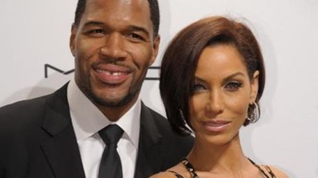 Michael Strahan and Nicole Murphy. (Getty)