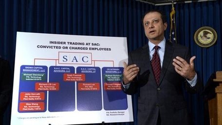 Preet Bharara speaks at a news conference about