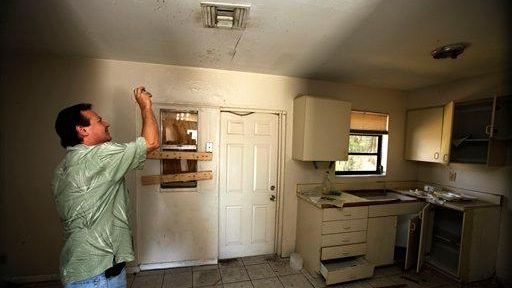 Frank Verna takes photos of a kitchen ceiling