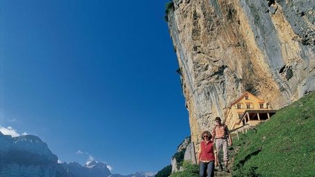 The Alpine restaurant Aescher-Wildkirchli in the rock face