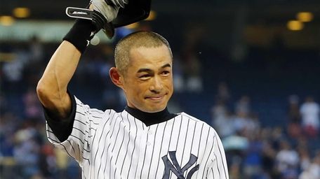 Ichiro Suzuki of the Yankees salutes the crowd