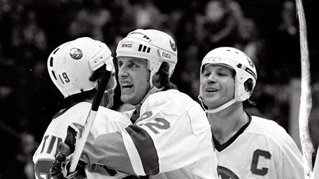MIKE BOSSY (pictured center) Right wing 58 goals,