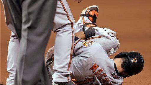 Baltimore Orioles third baseman Manny Machado grabs his