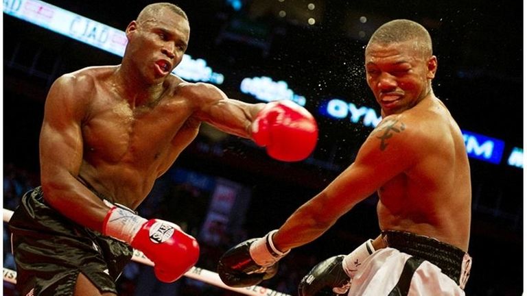Adonis Stevenson, left, lands a punch against Chad