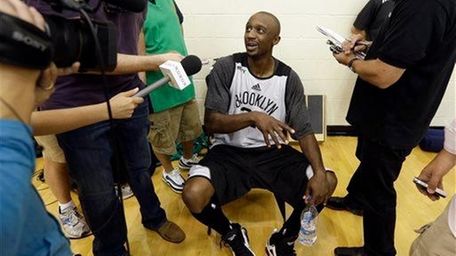 Jason Terry speaks with members of the media