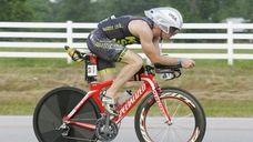 Ironman athlete Kevin Dessart competes in the cycling