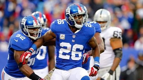 Antrel Rolle celebrates a sack in the fourth