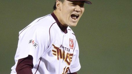 Rakuten Eagles starter Masahiro Tanaka celebrates his complete-game