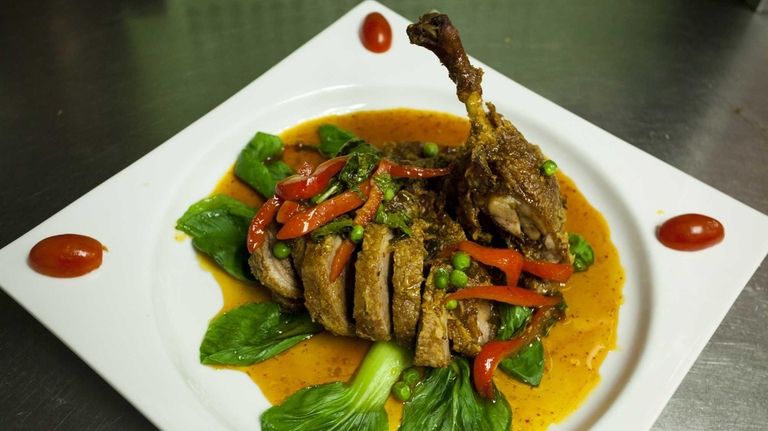 Bangkok Duck, crispy boneless duck topped with spicy