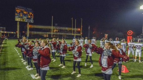 The Garden City High School cheerleading squad gets