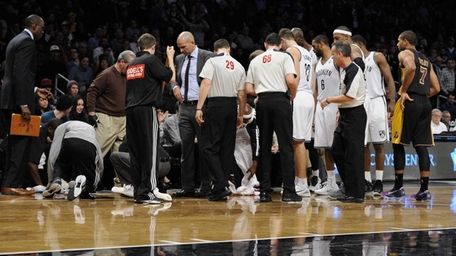 Nets court attendants clean up head coach Jason