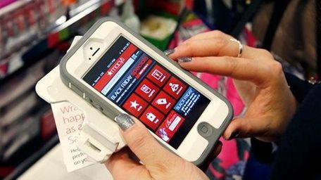 Tashalee Rodriguez, of Boston, uses a smart phone