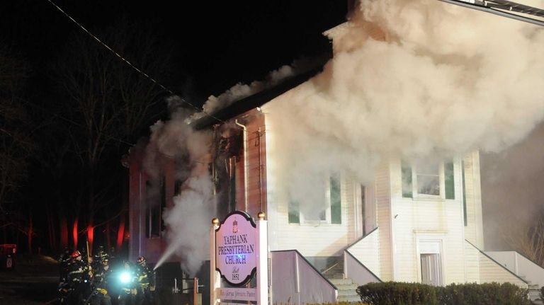 Firefighters battle a blaze at the Yaphank Presbyterian