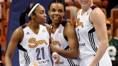 The Connecticut Sun's Renee Montgomery, left, Tan White,